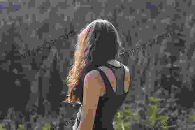 A Woman Hiking Through A Forest, Her Hair Flowing Behind Her, Symbolizing The Wild And Untamed Spirit Within. Woman And Nature: The Roaring Inside Her