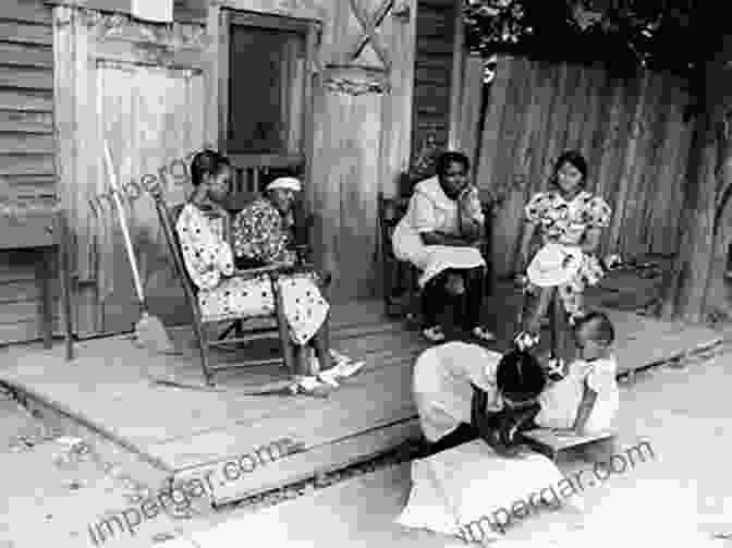 Elizabeth, An Elderly African American Woman, Sits On A Porch Surrounded By Her Family. Remembering Slavery: African Americans Talk About Their Personal Experiences Of Slavery And Emancipation