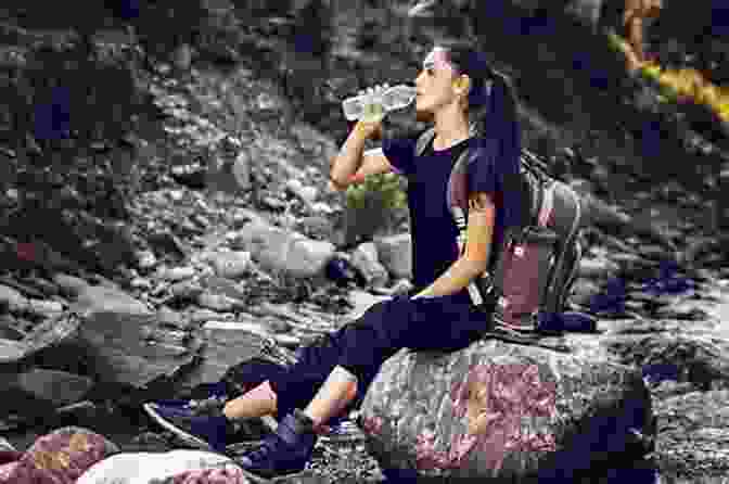 Woman Enjoying A Refreshing Drink Of Water While Hiking Weight Loss From The Inside Out: A Mind Body Awakening